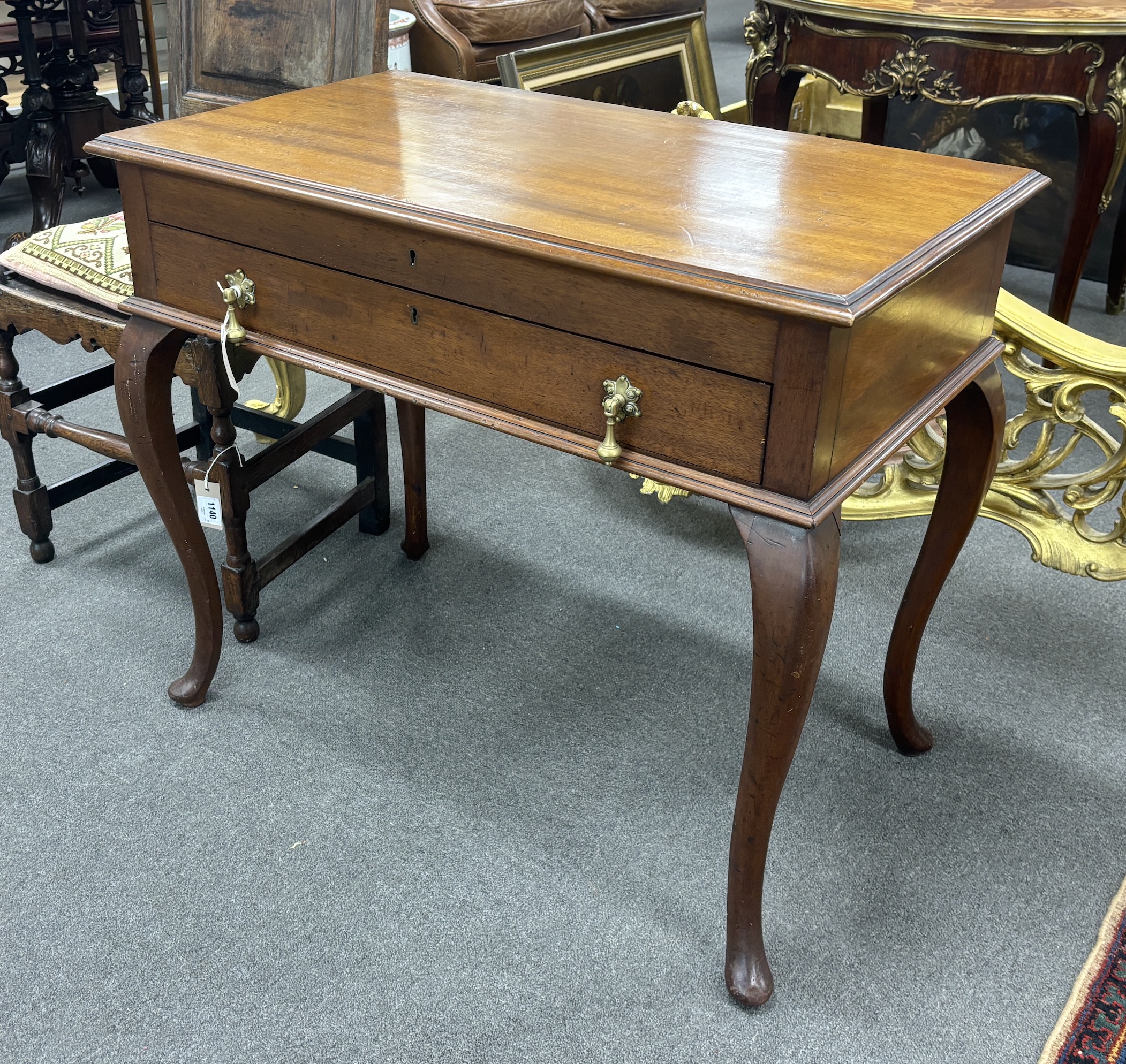 A 1920's mahogany cutlery table, width 85cm, depth 50cm, height 73cm